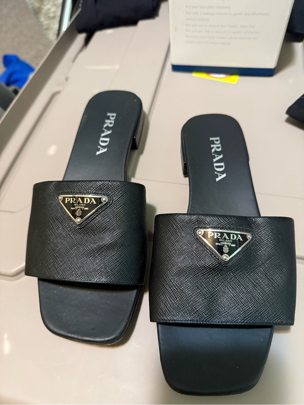 Prada Black Leather Slide Sandals with Gold Logo Accent